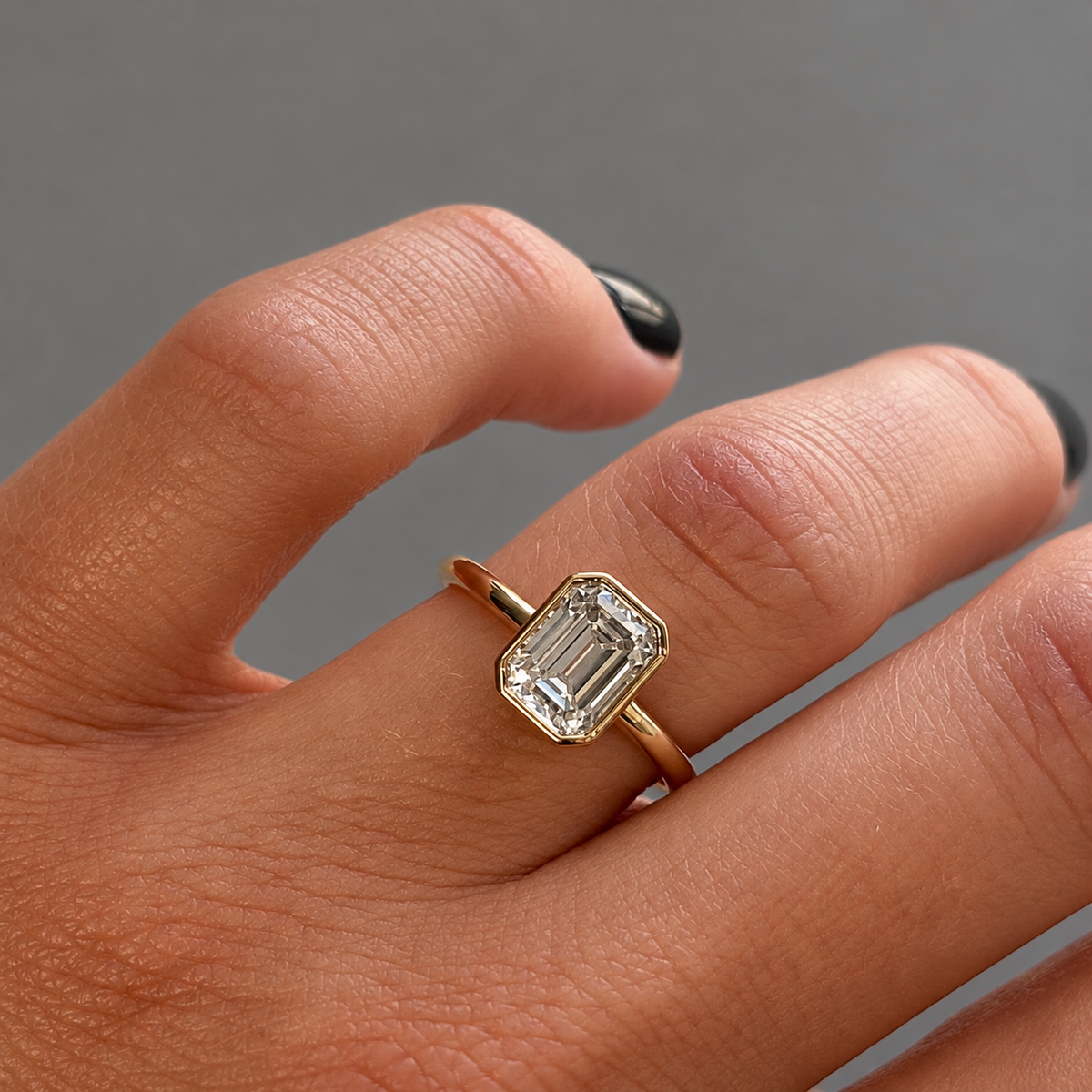 9ct Gold Bezel Set Emerald Cut Solitaire Ring
