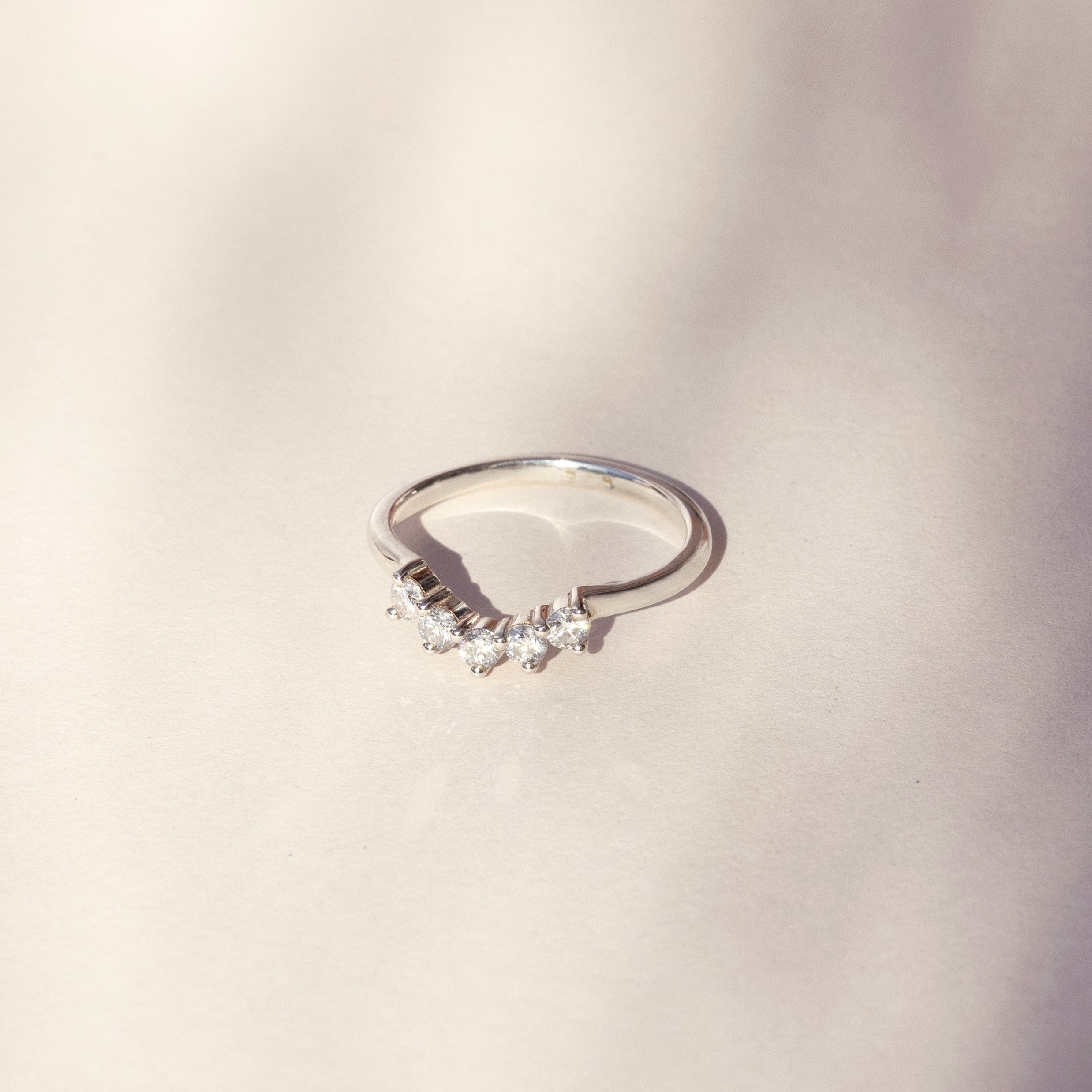 Curved tiara ring